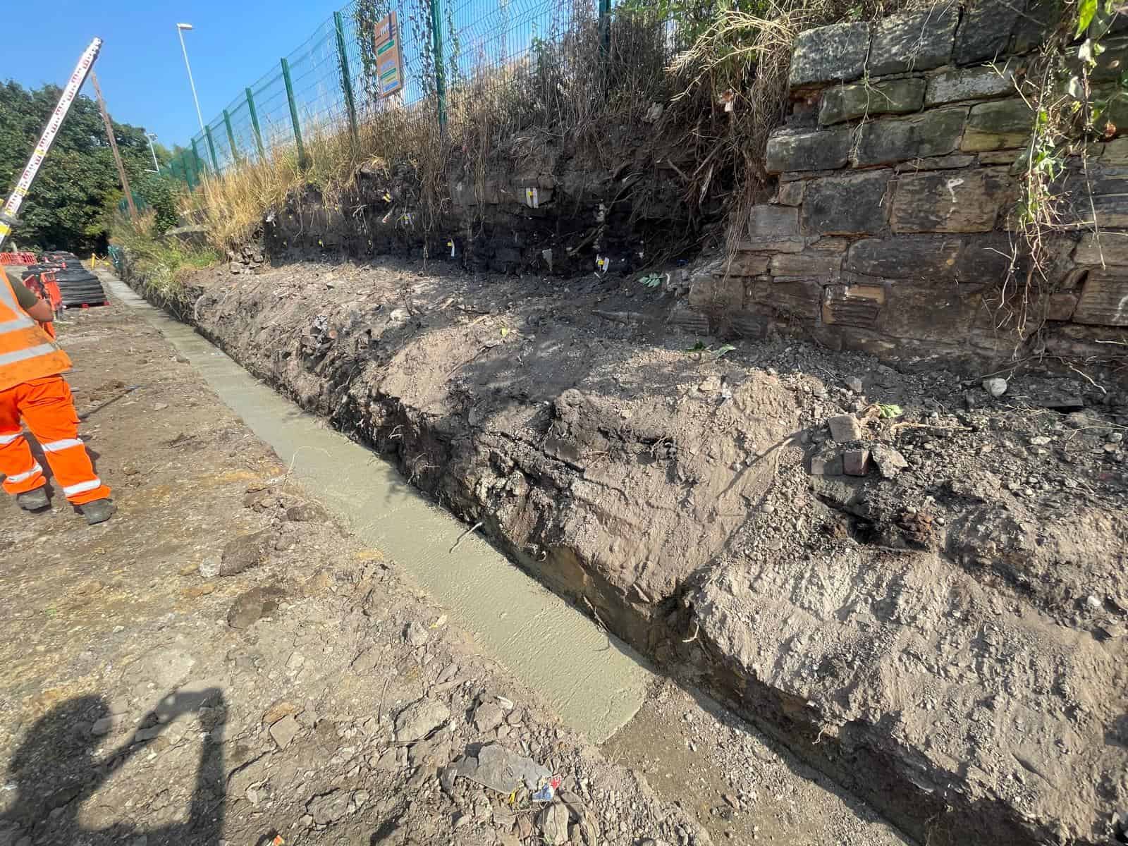 Palisade fencing installed behind ECO-MSE retaining wall at Normanton Station Car Park
