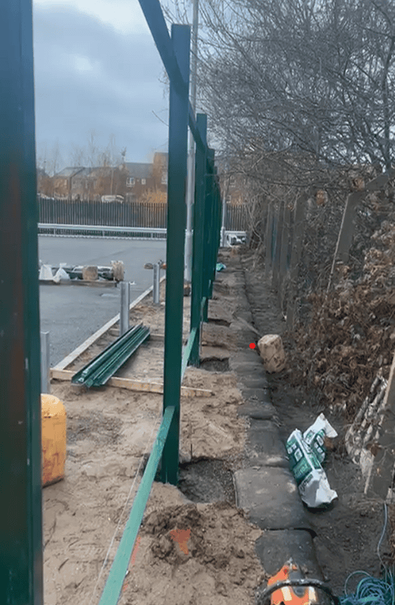 Green Gravity Walls supervisor inspecting ECO-MSE retaining wall during construction