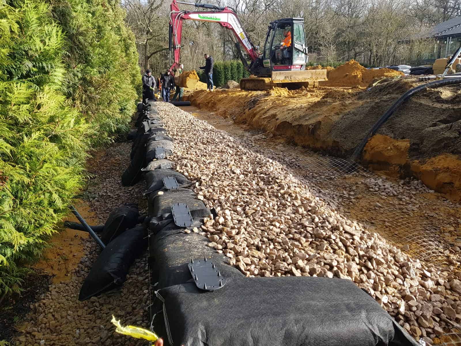 ECO-MSE bags being installed to form a retaining wall in Oxshott Surrey