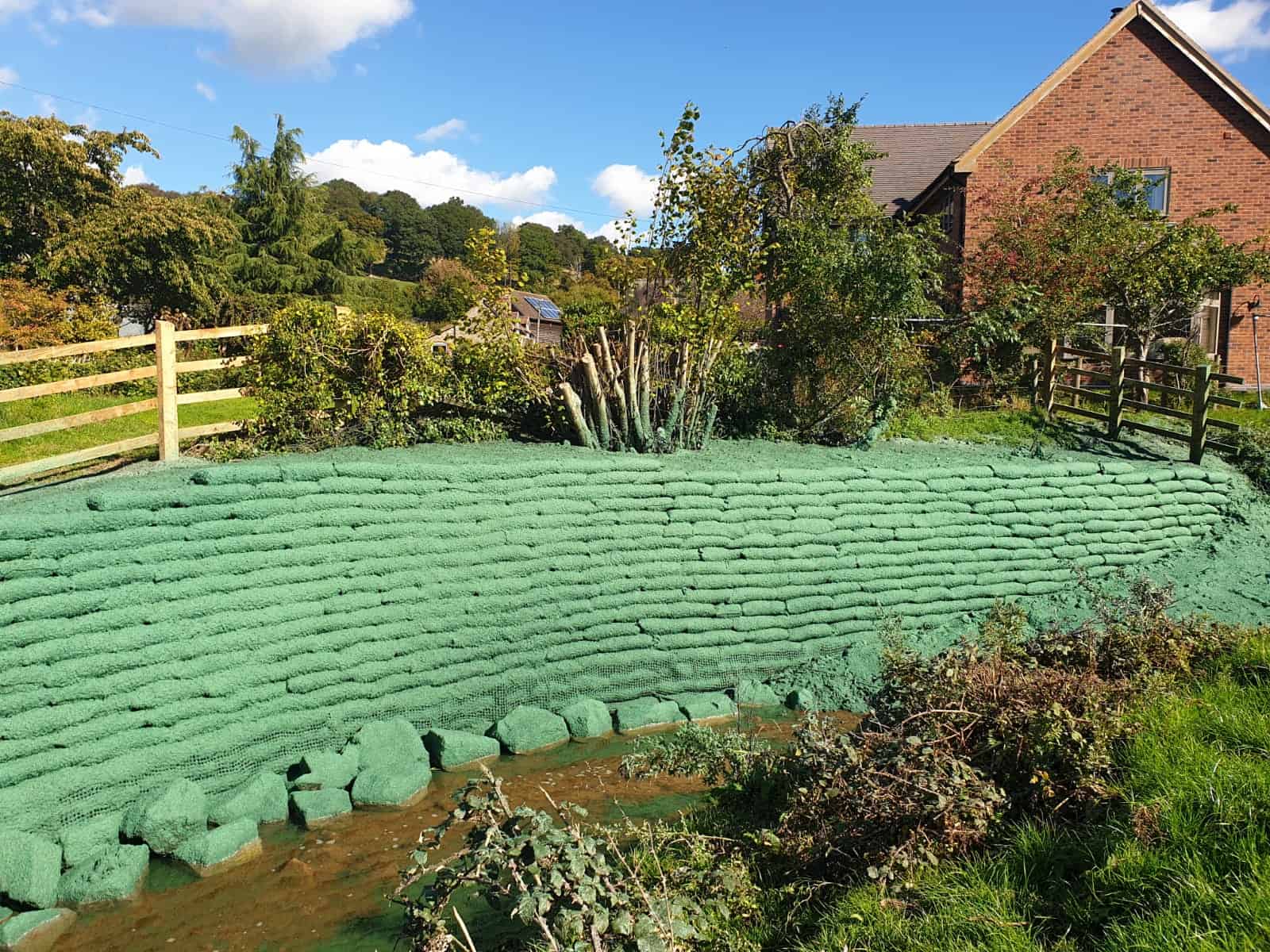 ECO-MSE bags installed in stepped layers for riverbank erosion control in Bouldon