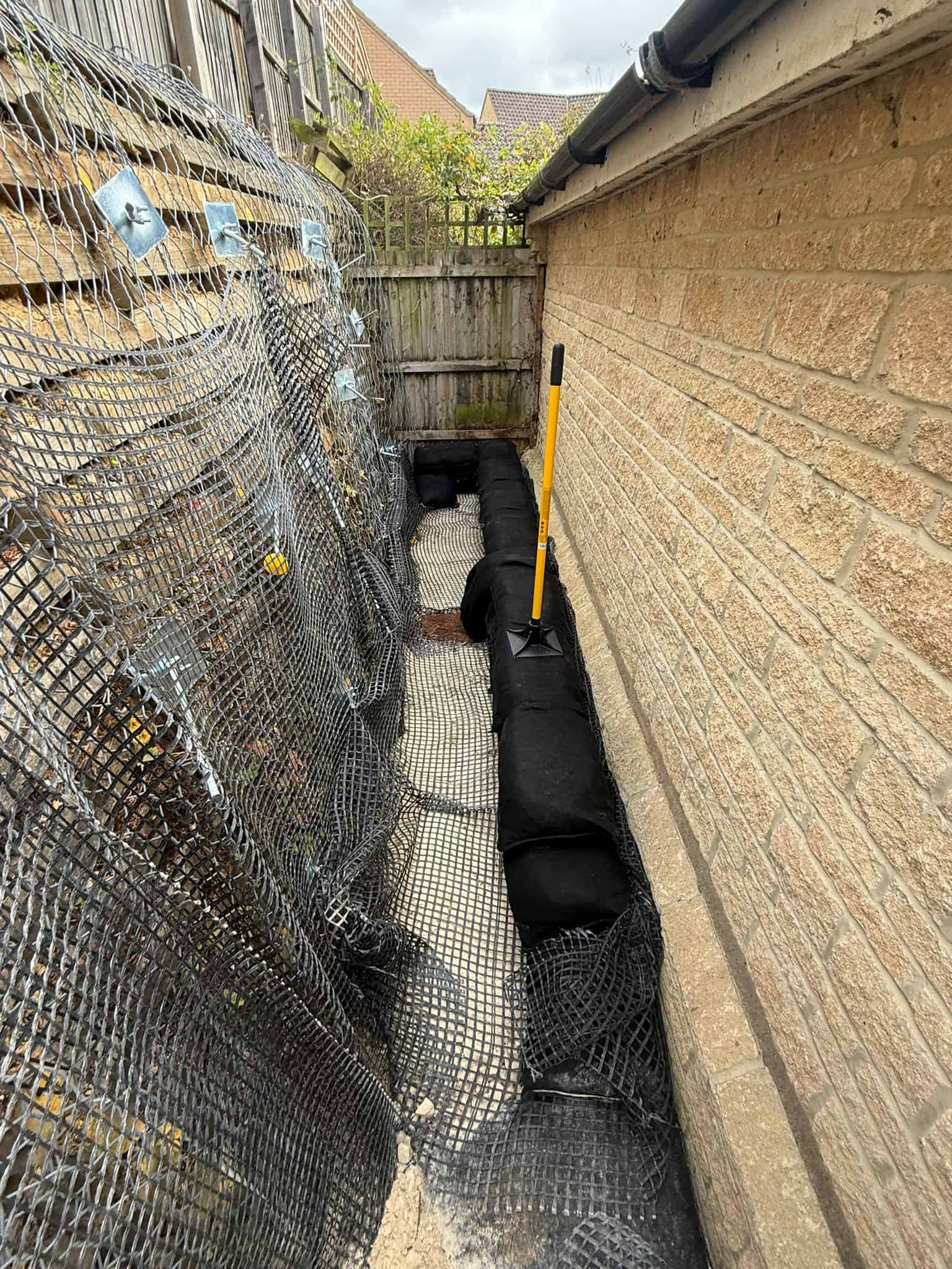 Stage 02 of ECO-MSE timber crib wall repair in Peterborough private garden